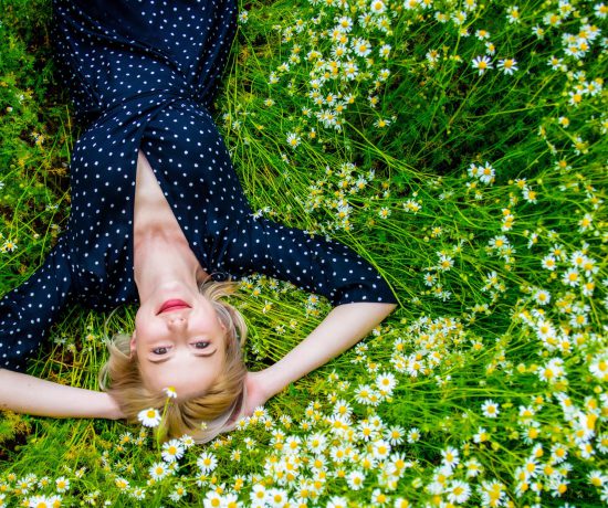 above view at blonde woman in black dress lying in 2022 01 07 19 34 38 utc scaled