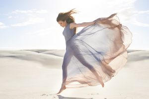 Freedom and isolation on the beach. Shot of a beautiful young woman on the beach